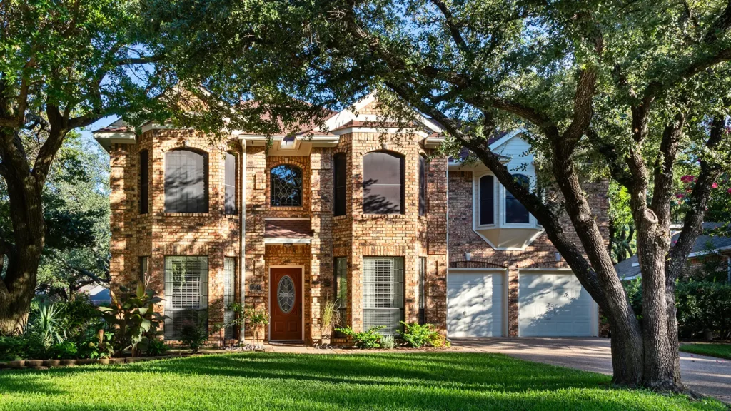 Texas home with mature landscaping that's supported by deep root watering
